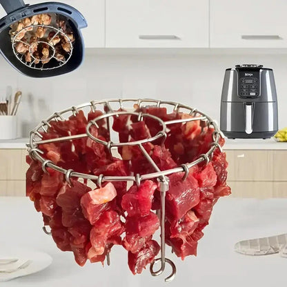 Ronde roestvrijstalen ovengrill met spies.