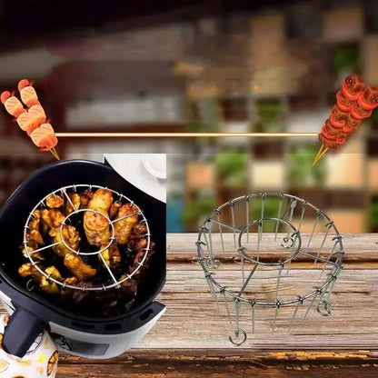 Ronde roestvrijstalen ovengrill met spies.
