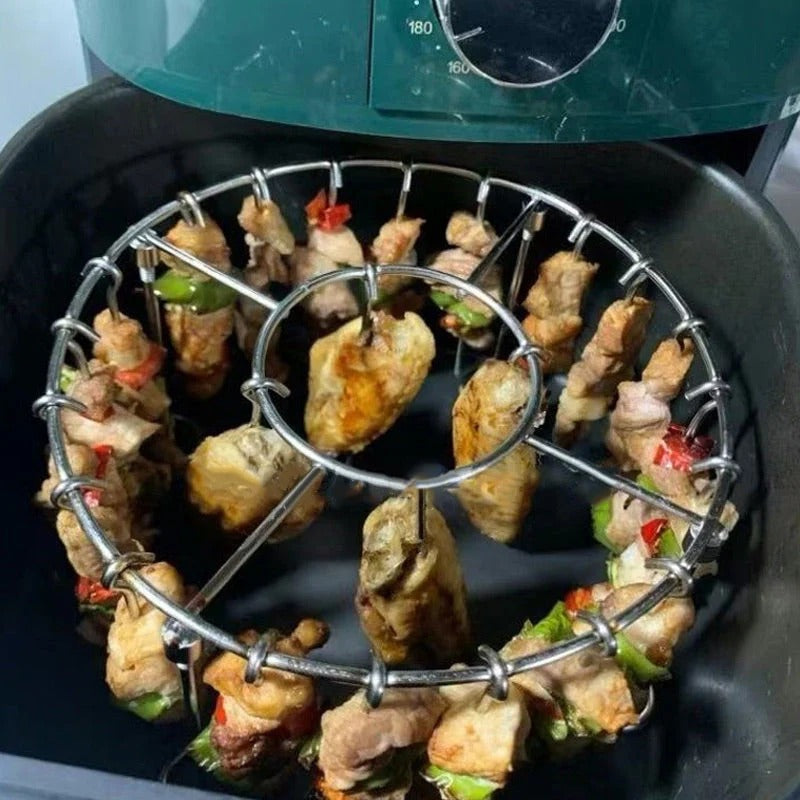 Ronde roestvrijstalen ovengrill met spies.